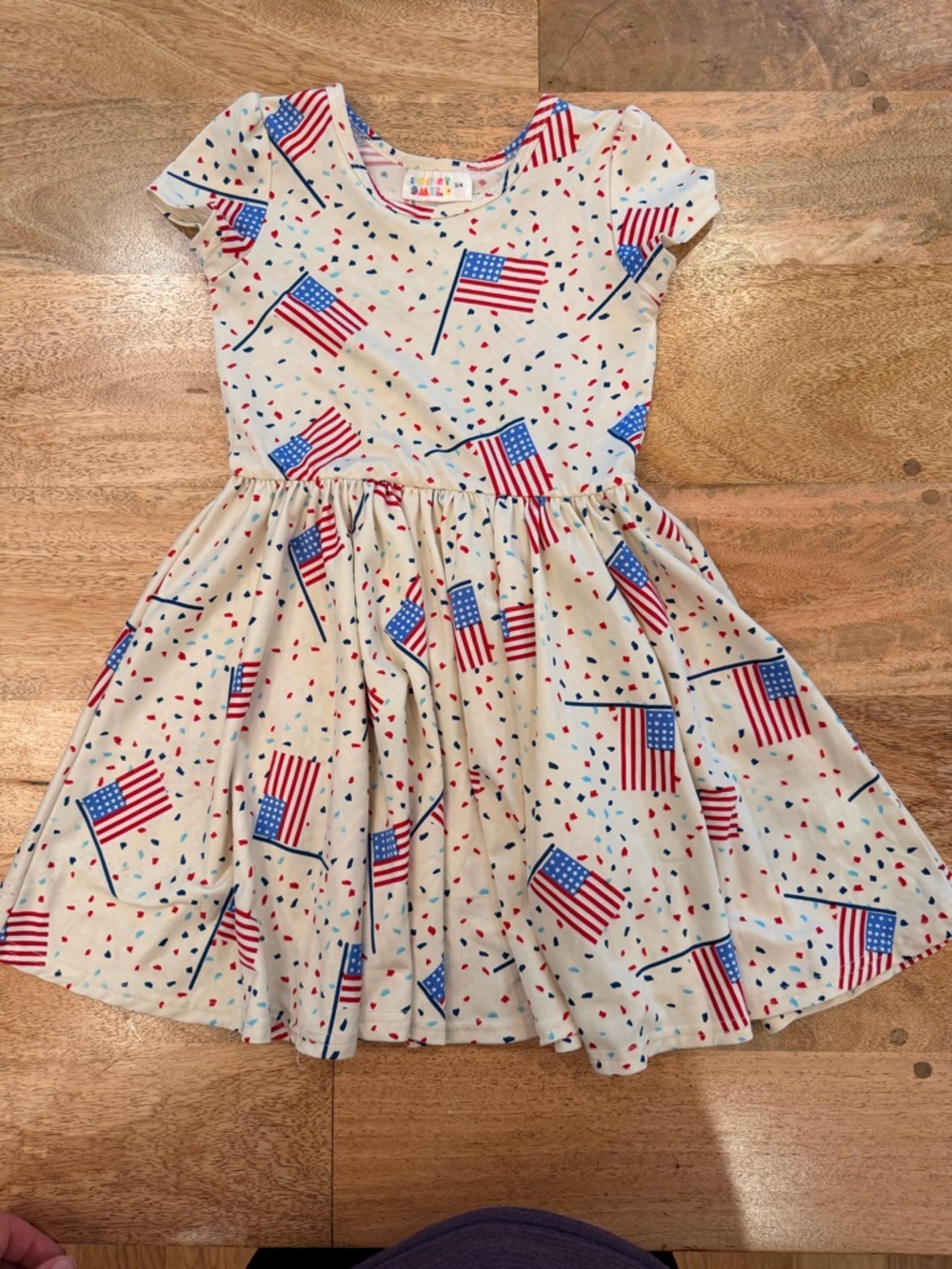 Dot Dot Smile Cream Dress with Red & Blue Flag Print